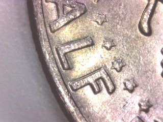 Kennedy-Half-With-Doubling-Letters-On-Half-Dollar-On-Reverse